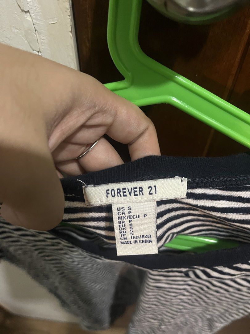 Forever 21 Striped T-shirt (Category: Shirts) located in Pasig City. Submitted by kakerts (Listing ID 1464290165, Image 3). Description: - Classic black and white striped t-shirt - Brand: Forever 21 - Style: Short sleeves, crew neck - Versatile: Pairs easily with jeans or shorts - Ideal for: Casual everyday wear.