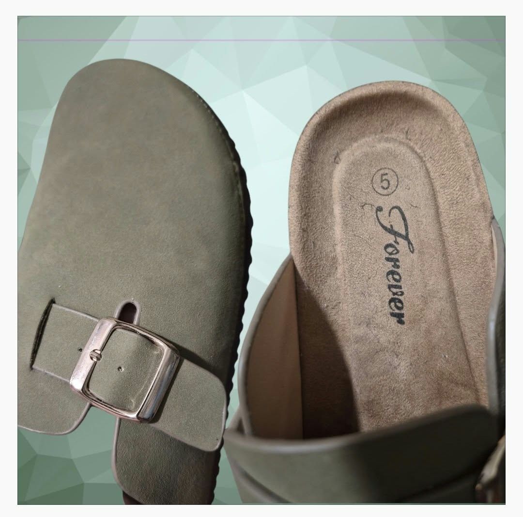 Forever Link Slip-on Mules (Category: Slippers and slides) located in Paranaque City. Submitted by calm_youngstore7 (Listing ID 1464326320, Image 3). Description: Forever Link classic pair of suede slip-on mules (often referred to as closed-toe clogs or potato shoes), characterized by a contoured cork-style footbed, an adjustable side-strap buckle, and a rounded toe profile. ₽1499.