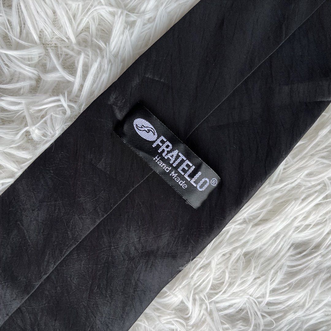 Fratello Hand Made Black Tie (Category: Ties) located in Cuyapo. Submitted by Ashtyn.Pre.Loved (Listing ID 1464203786, Image 2). Description: - Classic black tie from Fratello - Handmade quality - Subtle textured fabric pattern - Ideal for formal events and business wear - Simple and versatile accessory - A wardrobe staple.