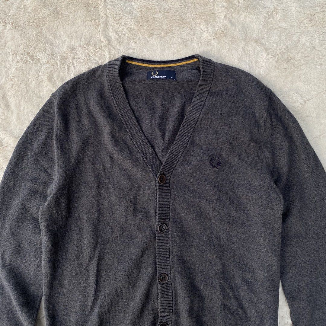 FRED PERRY KNITTED CARDIGAN LONG SLEEVE AUTHENTIC (Category: Coats, Jackets and Outerwear) located in Cadiz. Submitted by thrift_hunt_garage (Listing ID 1464253123, Image 2). Description: FRED PERRY KNITTED CARDIGAN LONG SLEEVE AUTHENTIC Size and measurements by inches : On tag Medium Width 20 Length 28 Sleeve 28 Conditions and details : Knitted material 6 button cardigan With Fred Perry engrave in button Issue none Flaws none.