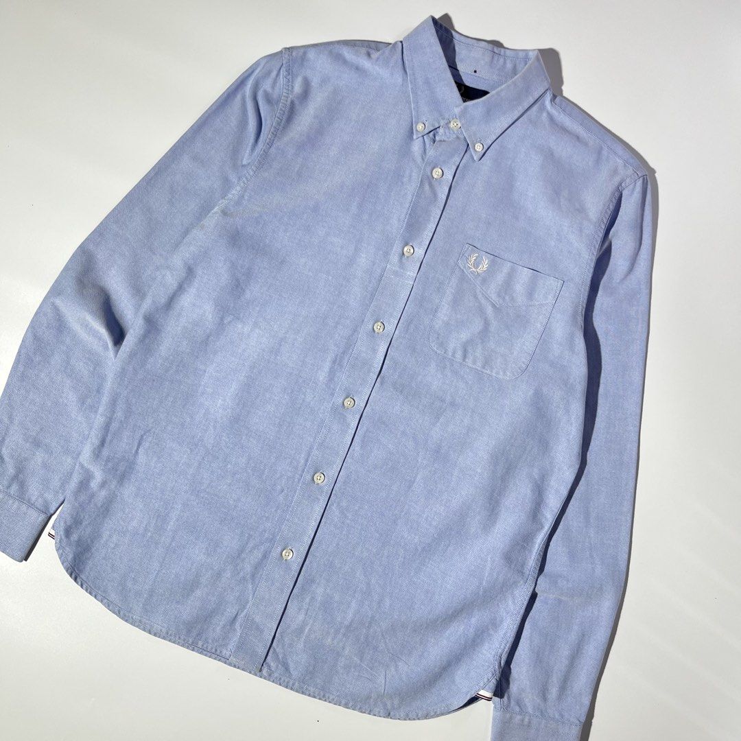 Fred Perry Oxford Shirt Blue Size M (Category: Formal Shirts) located in Panabo. Submitted by bae.sick_thirft (Listing ID 1464143002, Image 3). Description: Classic blue Oxford shirt from Fred Perry • Condition - Excellent • Color rate - 9.7/10 • Ribbings and hem masikip • Issue(s) - minimal marker (not visible) • Perfect for dates Dimes: • Width - 21 • Lenght - 29 • Size - Medium to Large Price - DM .