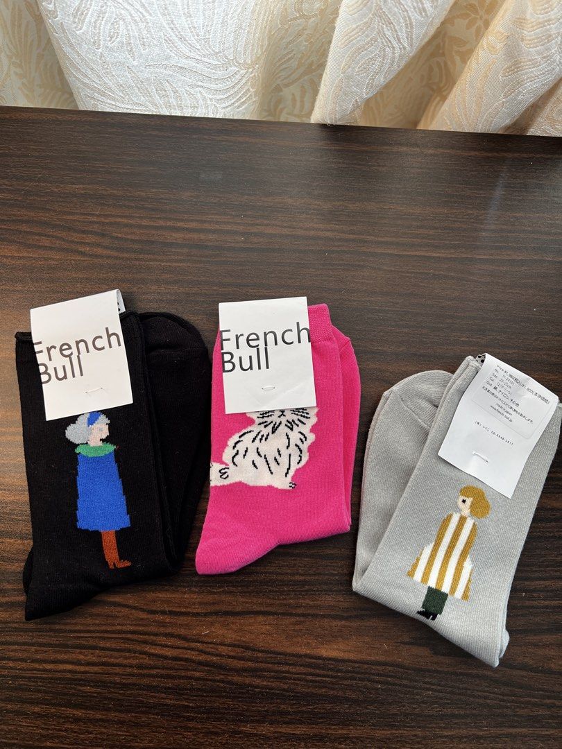 French Bull Socks - Cute Character Designs (Category: Socks & Tights) located in Makati City. Submitted by ciriacoria (Listing ID 1464184343, Image 2). Description: - Set of 5 French Bull socks - Features fun character designs: person in blue coat, fluffy dog, person in striped shirt, person in red dress, and a bird - Adds personality to any outfit - Soft and comfortable material.