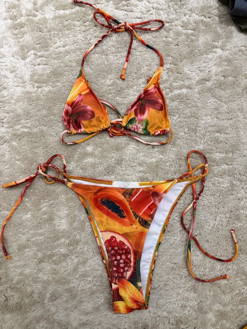 Fruit Print Halter Neck Bikini Set (Category: Bikinis & Swimsuits) located in Caloocan City. Submitted by croissant8765 (Listing ID 1464312155, Image 1). Description: - Adorable fruit print bikini - Halter neck top with adjustable tie closures - Matching bottoms with adjustable tie sides - Vibrant, fun tropical pattern - Ideal for beach vacations and pool days.