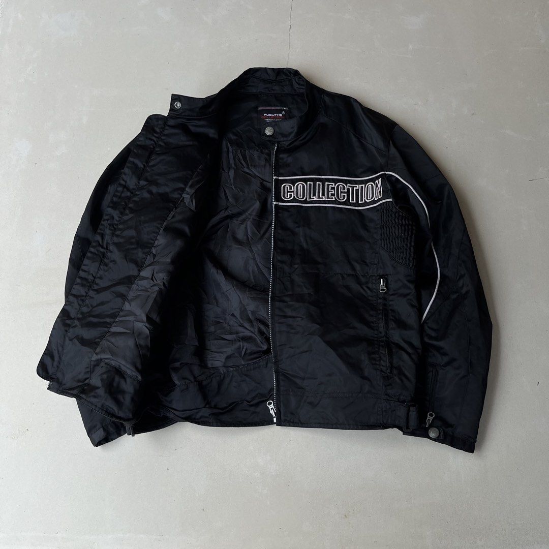 FUBU JEANS COLLECTION Black Jacket Y2k (Category: Coats, Jackets and Outerwear) located in Mandaue City. Submitted by chinsyap_03 (Listing ID 1464190772, Image 2). Description: - Black FUBU JEANS COLLECTION jacket - Size: Medium (M) - Front graphic: "FUBU JEANS COLLECTION" - Back text: "STANDARD UTILITY PRODUCT ITEM SERIAL F-C.09205 COMPANY PROPERTY" - Ideal for casual wear.