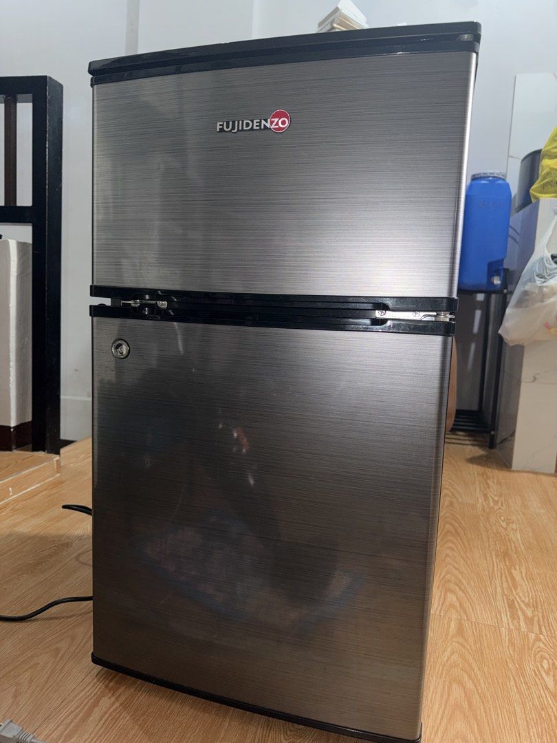 FUJIDENZO - RBT-35SL (Category: Refrigerators and Freezers) located in Manila. Submitted by 4lel3e (Listing ID 1464141003, Image 1). Description: With original box, warranty/manual paper, and keys. - Hard top - Key lock - Energy Efficient Compressor - 3.5 CUFT Purchased on June 2025. RFS: Upgrade Issue: May dent lang po sa pinto. Yung visible sa picture. All working po even key, freezer, and ref itself. Lady owned..