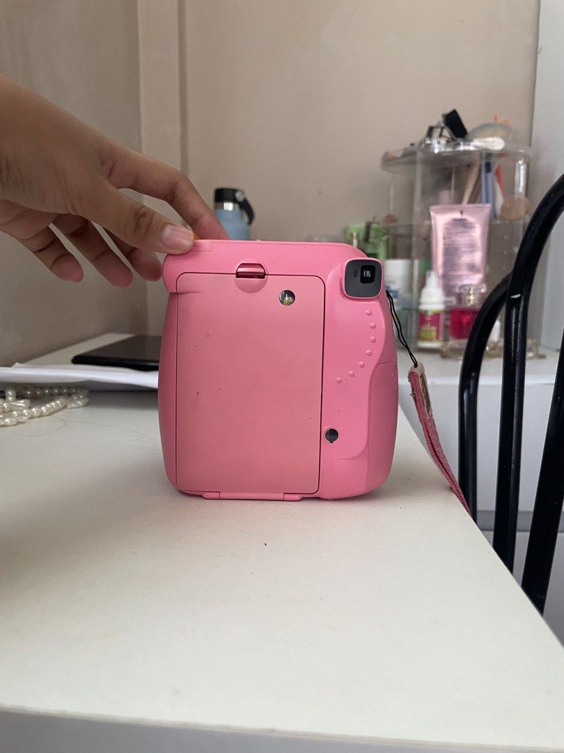 Fujifilm Instax Mini 9 Pink Instant Camera (Category: Cameras) located in Baao. Submitted by closetbykb (Listing ID 1464183365, Image 3). Description: - Pink Fujifilm Instax Mini 9 camera - Takes instant photos - Comes with a strap - Ready for adventures and events - Requires film and batteries (not included) - with leather bag included.