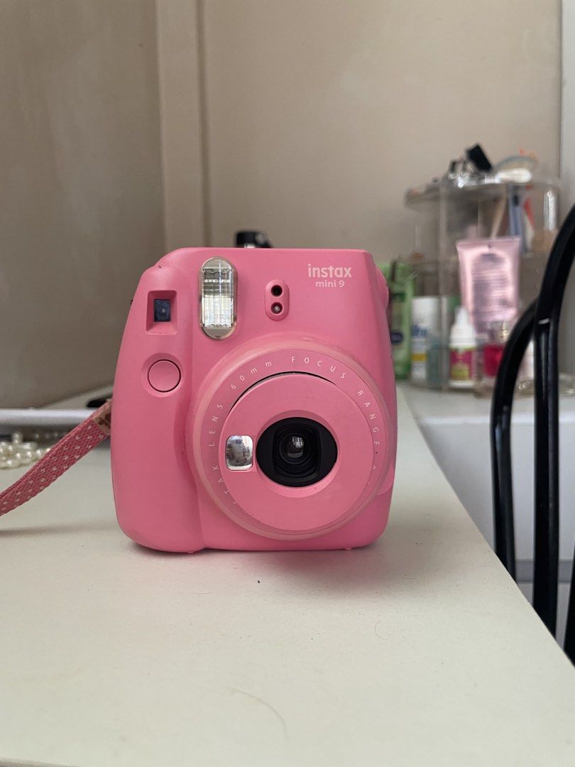 Fujifilm Instax Mini 9 Pink Instant Camera (Category: Cameras) located in Baao. Submitted by closetbykb (Listing ID 1464183365, Image 2). Description: - Pink Fujifilm Instax Mini 9 camera - Takes instant photos - Comes with a strap - Ready for adventures and events - Requires film and batteries (not included) - with leather bag included.