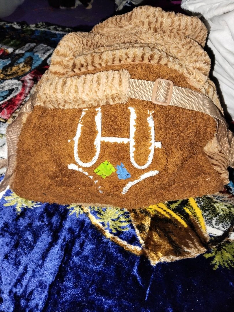 Fuzzy Plush Handbag / Back pack (Category: Cross-body Bags) located in Mabalacat. Submitted by al_amin_thrift (Listing ID 1464233356, Image 1). Description: 🧸 Fuzzy Plush Handbag / Backpack — Brown Cozy Style Item Details - Type: Soft plush/faux-fur bag — convertible design: top handles + adjustable shoulder/crossbody straps ​ - Colors: Warm chocolate brown front panel with lighter tiger-stripe textured tan sides, handles & top ​ - Material: Ult