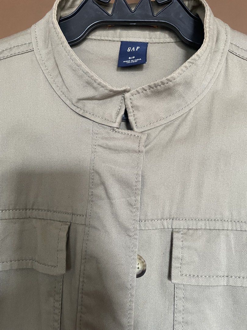 GAP Khaki Utility Jacket (Category: Coats, Jackets and Outerwear) located in Manila. Submitted by mochi_dear (Listing ID 1464164575, Image 2). Description: - GAP Khaki Utility Jacket - Button-up front - Two chest pockets - Mandarin collar style - Ideal for layering - Pairs well with jeans or casual pants - Great for everyday wear.