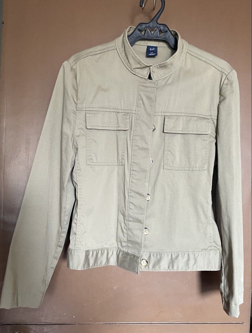GAP Khaki Utility Jacket (Category: Coats, Jackets and Outerwear) located in Manila. Submitted by mochi_dear (Listing ID 1464164575, Image 1). Description: - GAP Khaki Utility Jacket - Button-up front - Two chest pockets - Mandarin collar style - Ideal for layering - Pairs well with jeans or casual pants - Great for everyday wear.