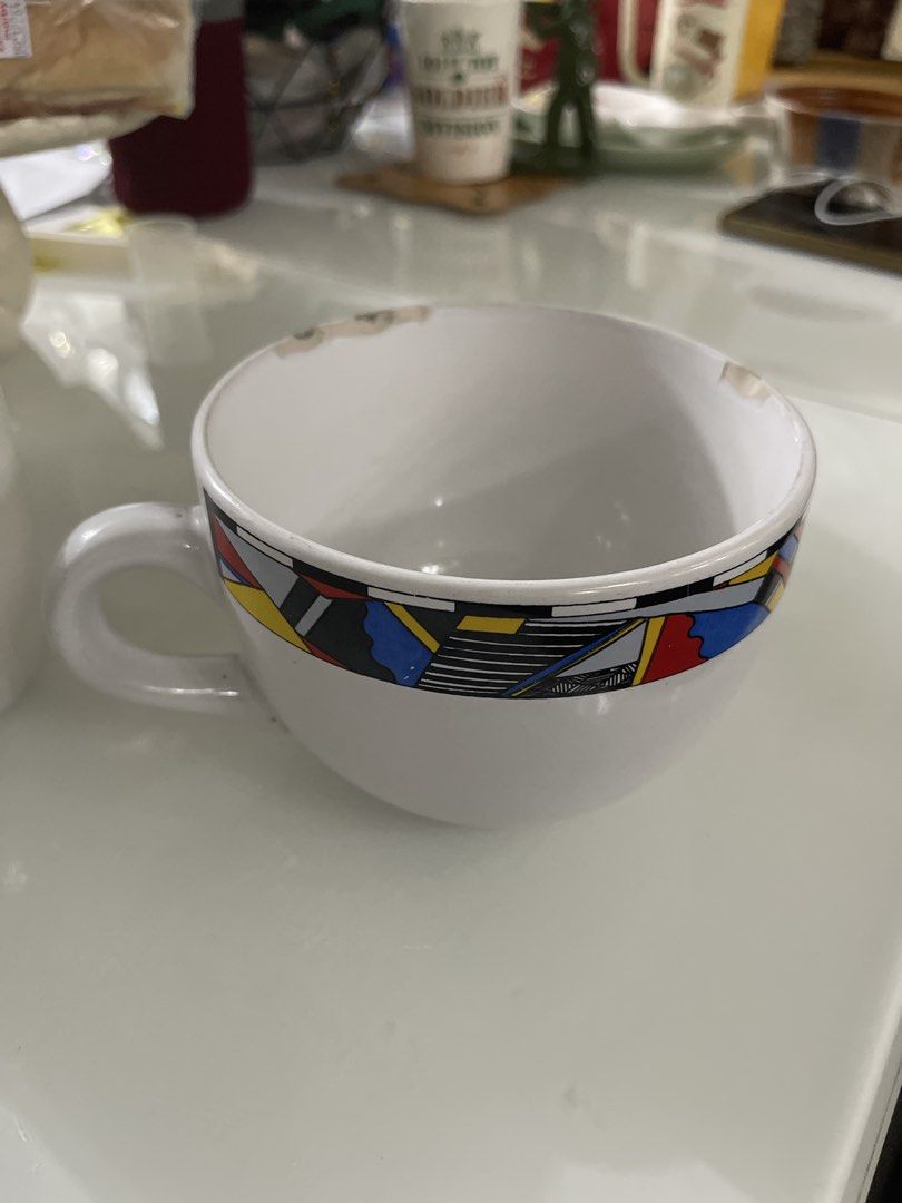Giant Mug & Starbucks Pullbbang Coffee Mug (Category: Coffee & Tea Tableware) located in Manila. Submitted by raresoft (Listing ID 1464156773, Image 2). Description: - Set of two white ceramic mugs - One features the classic Starbucks logo - The other has a vibrant geometric pattern on the rim - Both mugs have small chips on their rims (adds character!) - Ideal for coffee or tea lovers - Unique additions to any mug collection.