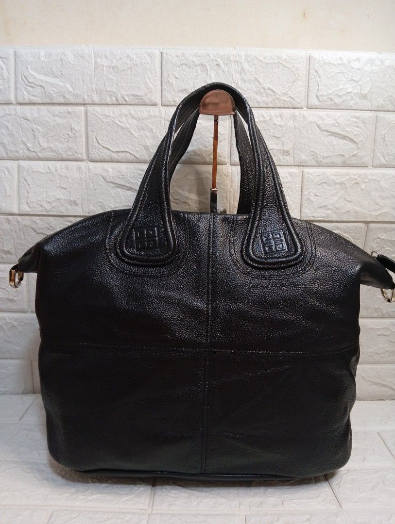 Givenchy Black Leather Nightingale Handbag (Category: Shoulder Bags) located in Las Pinas. Submitted by etoksi1234 (Listing ID 1464198091, Image 2). Description: Pre-loved Givenchy Nightingale bag featuring dual top handles, structured paneling, and embossed 4G logo accents on the handle patches. No sling Included..