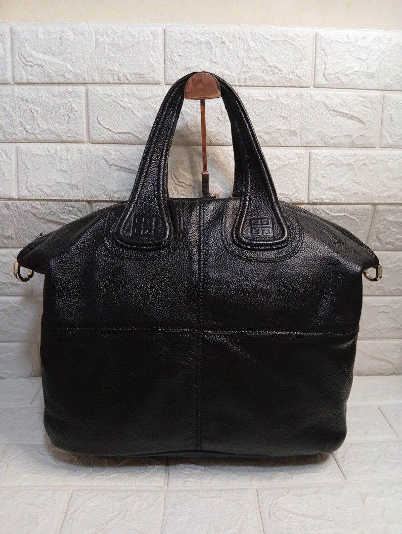 Givenchy Black Leather Nightingale Handbag (Category: Shoulder Bags) located in Las Pinas. Submitted by etoksi1234 (Listing ID 1464198091, Image 1). Description: Pre-loved Givenchy Nightingale bag featuring dual top handles, structured paneling, and embossed 4G logo accents on the handle patches. No sling Included..