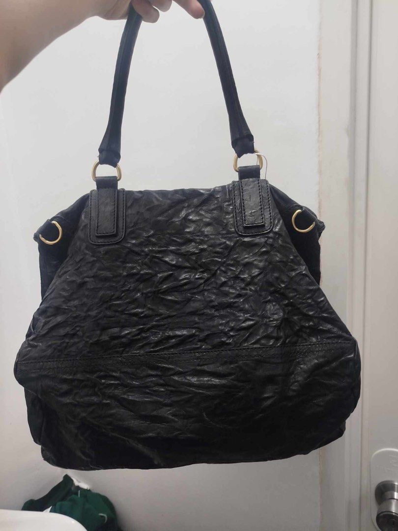 Givenchy Black Leather Wrinkled Tote Bag (Category: Tote Bags) located in Mandaluyong City. Submitted by tonsaribay58244 (Listing ID 1464276196, Image 2). Description: - Authentic Givenchy bag in black - Made from soft, wrinkled leather - Elegant gold zippers and hardware - Two comfortable top handles - Spacious interior, perfect for everyday use - entrupy certificate .
