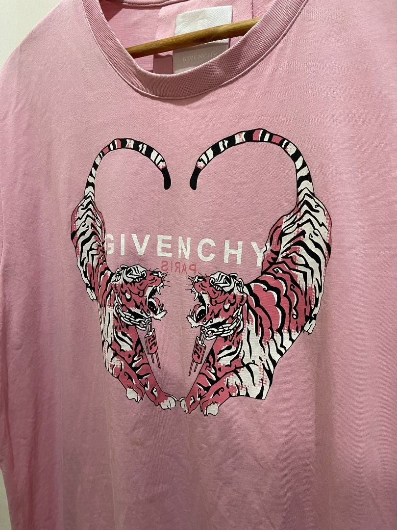 GIVENCHY 'HEART PINK TIGER' SHIRT (Category: Formal Shirts) located in Manila. Submitted by ako.si.lemmor (Listing ID 1464286882, Image 2). Description: This item is thrifted, manage your expectation. Dimes: 22.5X27 (L-XL) Color rate: 8.5/10 Issue: Slight print fade Ship at your own cost or pickup Mandaluyong..