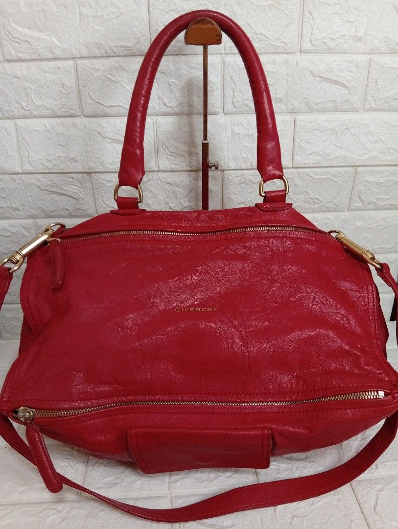 Givenchy Pandora Striking Red 2-way Leather Bag (Category: Luxury Bags & Wallets) located in Las Pinas. Submitted by etoksi1234 (Listing ID 1464204272, Image 1). Description: Givenchy Pandora striking red bag features a distinct, wrinkled sheepskin leather texture and signature gold-tone lettering. Lampu underzip. (Issue- inside lining). .