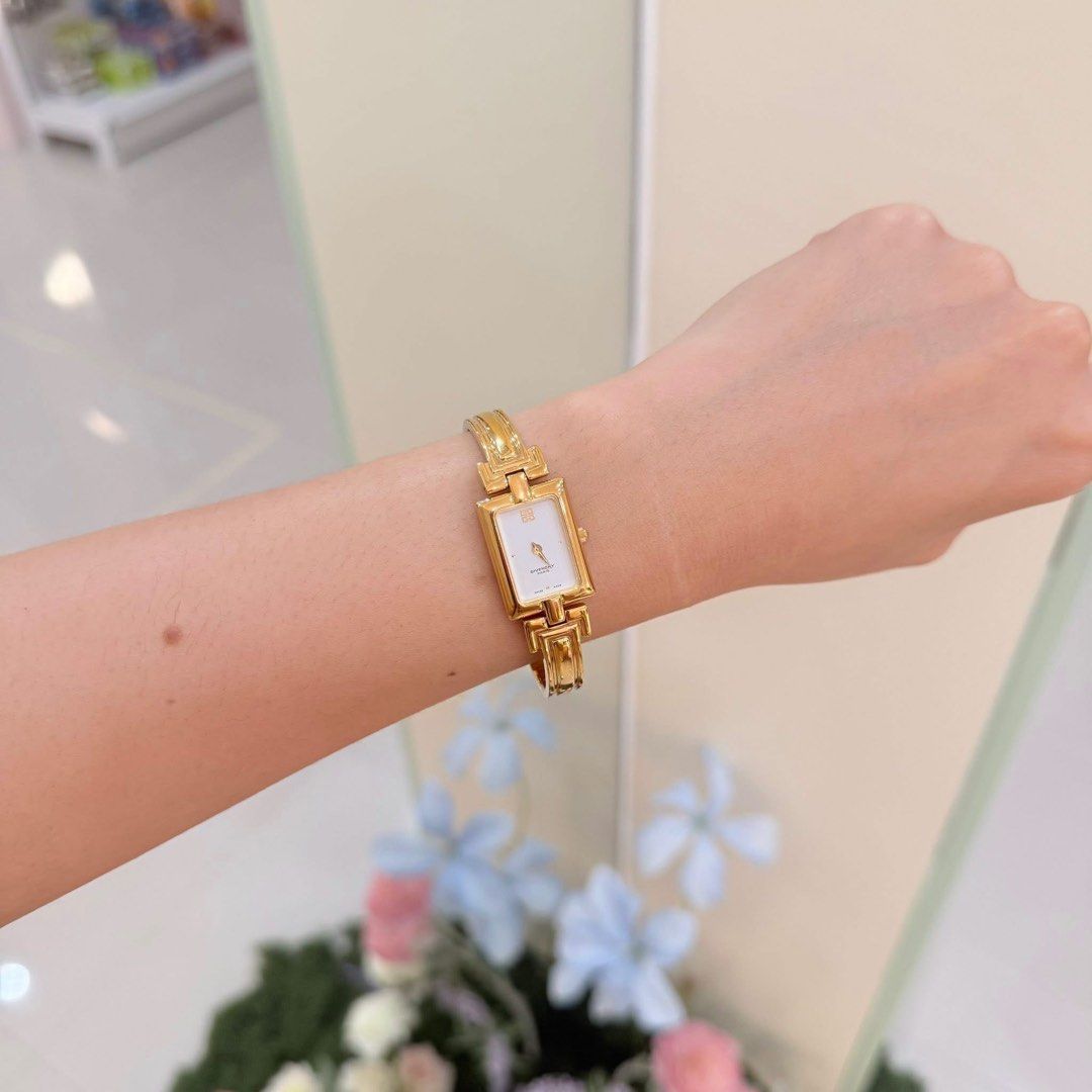 Givenchy Paris Gold Watch Rectangle Face Swiss Made (Category: Women's Watches) located in San Leonardo. Submitted by iluvkopiii (Listing ID 1464159321, Image 1). Description: Authentic Vintage Givenchy Gold Bangle Watch Good as new condition, carefully maintained and well kept. Bought in Japan.