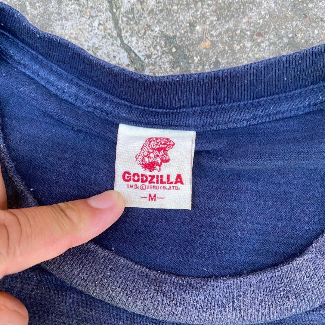 Godzilla (Category: Tshirts & Polo Shirts) located in Kota Bharu. Submitted by dhirrow.store (Listing ID 1464267595, Image 3). Description: - Godzilla - 19x27 - bebas koyak & lubang - warna pudar - 8/10 cun.