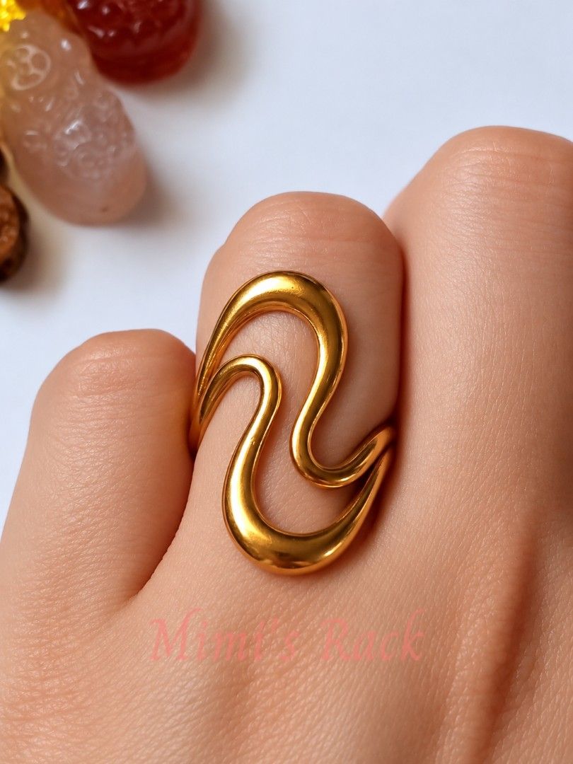 Gold-Tone Open Cuff Ring – Elegant Curved Design (Category: Rings) located in Taguig. Submitted by mimisrack (Listing ID 1464238353, Image 3). Description: 💛Simple yet eye-catching gold-tone open cuff ring featuring a sleek, flowing double-curve design. -The smooth polished finish gives it a clean and elegant look that easily complements both casual and dressy outfits. 💛 -Perfect for everyday styling or as a simple accent when you want somethin