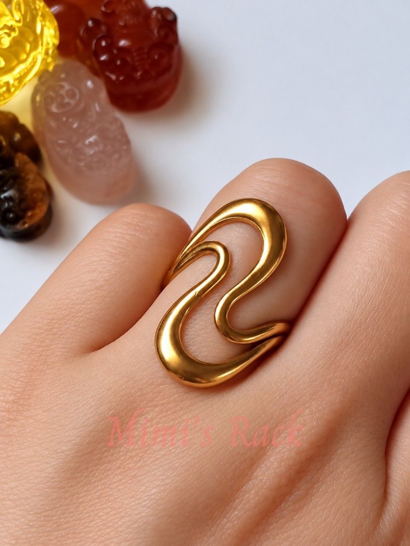 Gold-Tone Open Cuff Ring – Elegant Curved Design (Category: Rings) located in Taguig. Submitted by mimisrack (Listing ID 1464238353, Image 1). Description: 💛Simple yet eye-catching gold-tone open cuff ring featuring a sleek, flowing double-curve design. -The smooth polished finish gives it a clean and elegant look that easily complements both casual and dressy outfits. 💛 -Perfect for everyday styling or as a simple accent when you want somethin