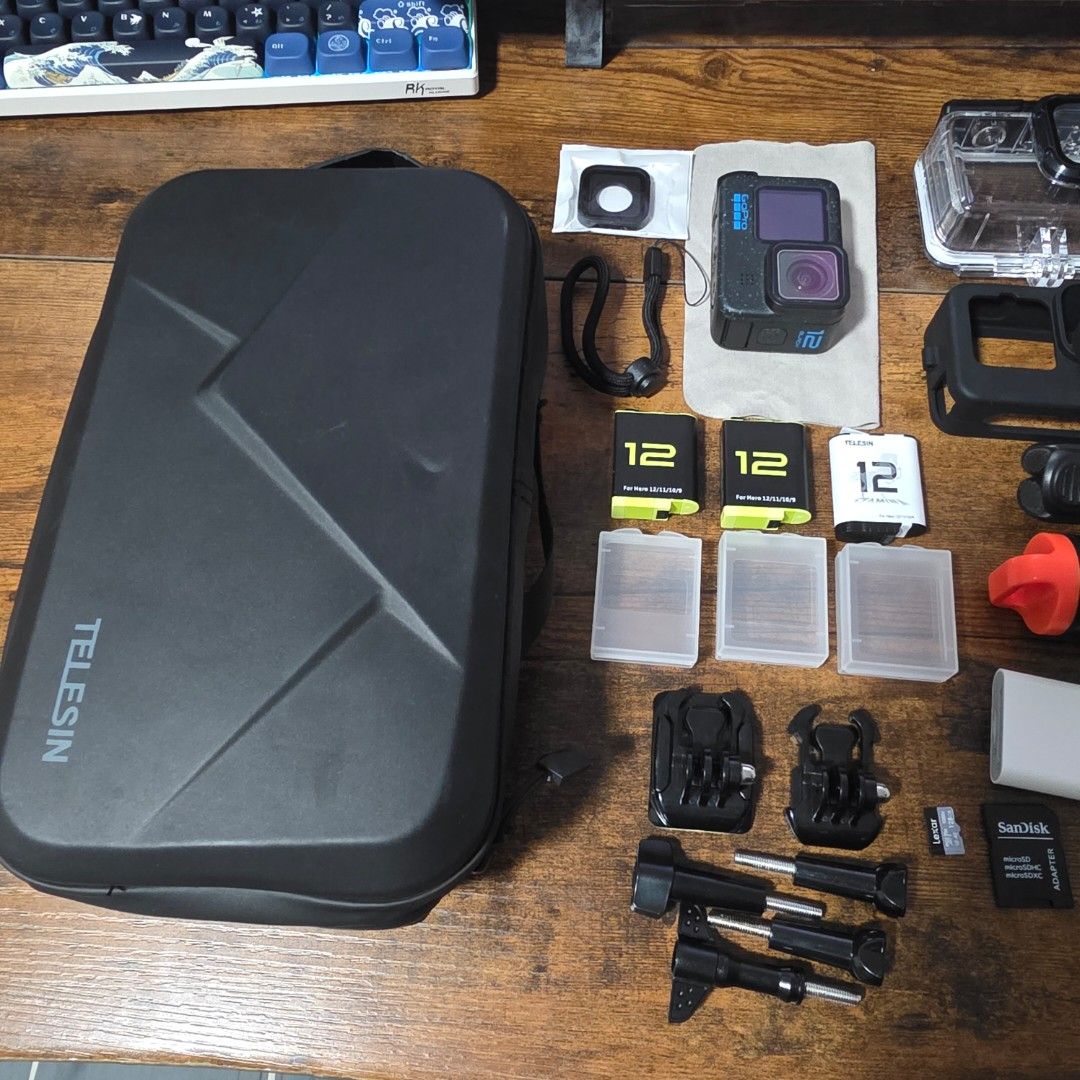 GoPro Hero 12 Black + Complete Accessories Bundle (Category: Cameras) located in Bocaue. Submitted by _sungjinwoo (Listing ID 1464333244, Image 3). Description: Selling my GoPro Hero 12 Black with accessories. Perfect for travel, rides, swimming, vlogging, outdoor activities, etc. Ready to use agad. INCLUSIONS: GoPro HERO 12 Black 2x Original GoPro Batteries 1x TELESIN Battery 3x Battery Cases 1x 3-Slot Battery Charger 1x TELESIN Carrying/Storage