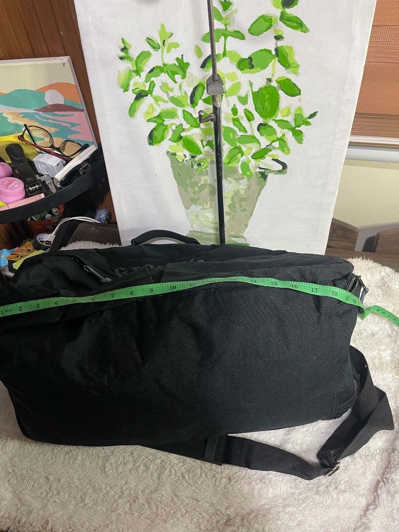 GrayMice Black Duffel Bag with Shoulder Strap (Category: Sling Bags) located in Naawan. Submitted by twilly.apparel2 (Listing ID 1464344684, Image 3). Description: - issue sa loob na peel off napo ang leather lining niyo sa loob and ang Isang zipper sira Brand: GrayMice - Color: Black - Features: Main compartment, front pockets, detachable shoulder strap - Approximate Measurements: 18 inches long, 13 inches tall - Condition: Good, with some wear 