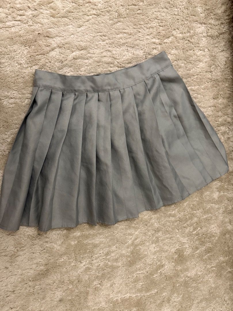 Grey Pleated Mini Skirt (Category: Skirts) located in Caloocan City. Submitted by croissant8765 (Listing ID 1464314027, Image 2). Description: - Grey pleated mini skirt - School uniform style - Very cute and versatile - Can be dressed up or down - Great for everyday wear or costumes - Easy to style with different tops.