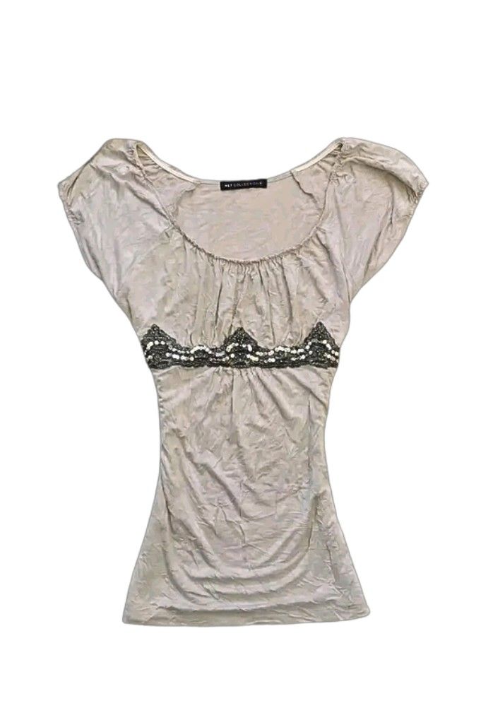 Grey Ruched Top with Beaded Embellishment (Category: Sleeveless) located in Tiaong. Submitted by cdoswan (Listing ID 1464273870, Image 1). Description: - Grey short-sleeved top - Ruched neckline detail - Decorative beaded trim across the chest - Fabric with a slight sheen - Very flattering fit - Perfect for dressing up or down.