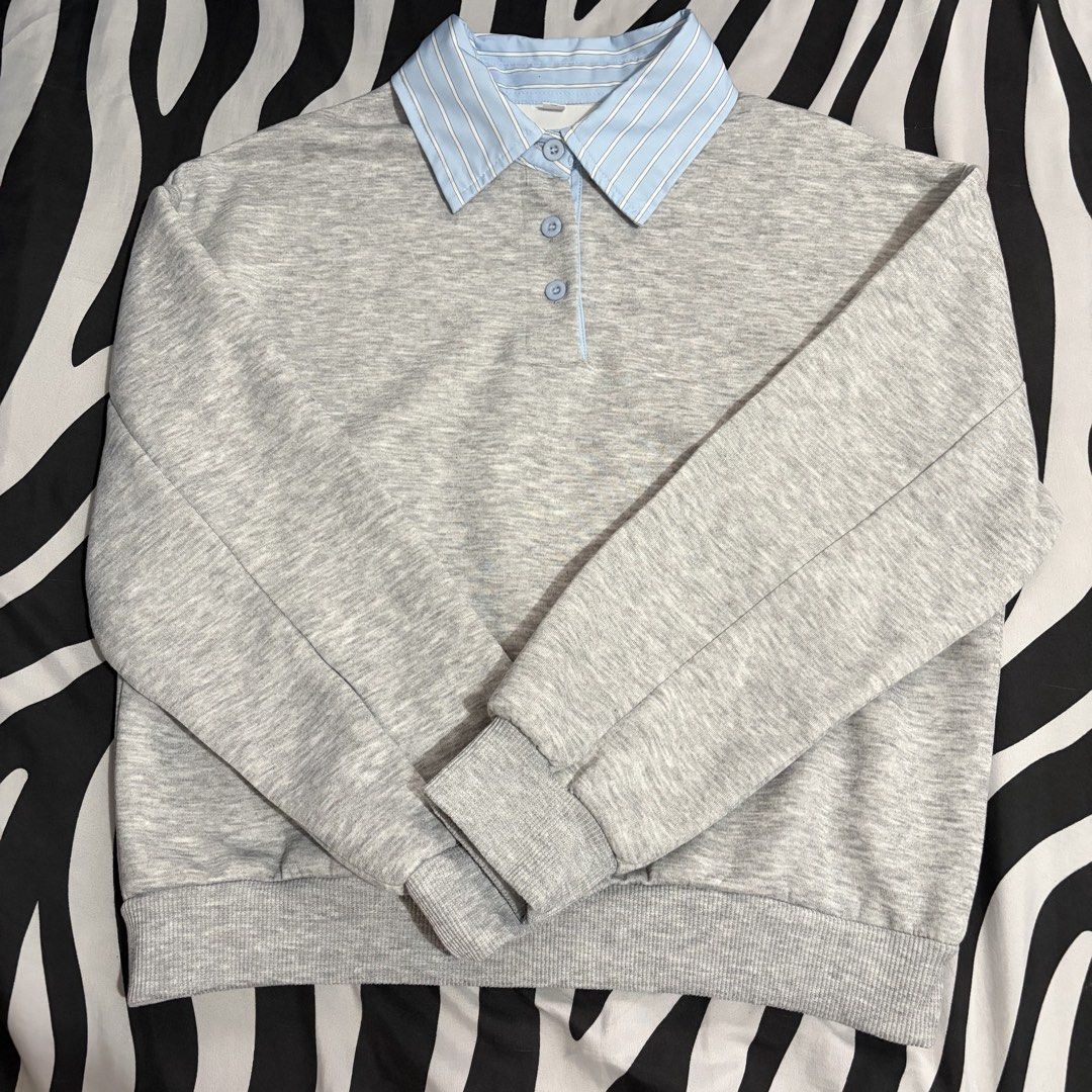 Grey Sweatshirt with Blue Striped Collar (Category: Coats, Jackets and Outerwear) located in San Juan City. Submitted by nadzbautista (Listing ID 1464163576, Image 1). Description: - Grey sweatshirt - Light blue and white striped collar - Button-up placket at the neck - Long sleeves with ribbed cuffs Loc: San Juan City 📍 Mop: BPI, Maribank, GCash Mod: J&T, Lalamove.