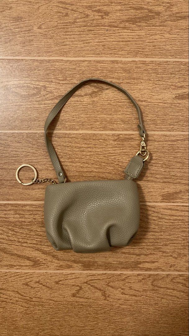 Grey Textured Pouch with Keychain and Strap (Category: Purses & Pouches) located in Subic. Submitted by bottomjeanzgals (Listing ID 1464336886, Image 1). Description: -wristlet wallet -beige -size small .