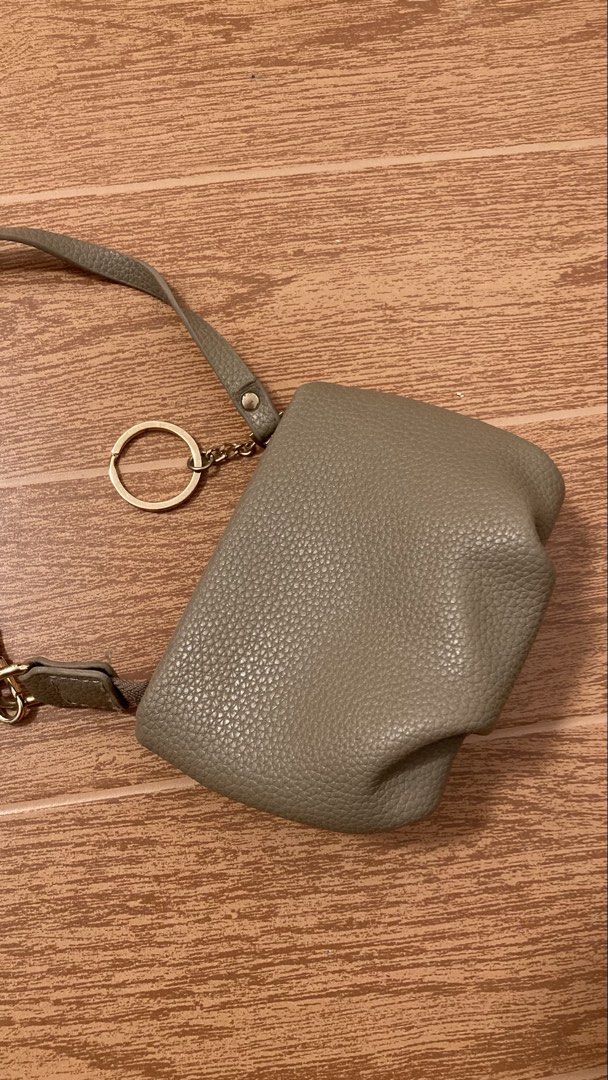 Grey Textured Pouch with Keychain and Strap (Category: Purses & Pouches) located in Subic. Submitted by bottomjeanzgals (Listing ID 1464336886, Image 2). Description: -wristlet wallet -beige -size small .