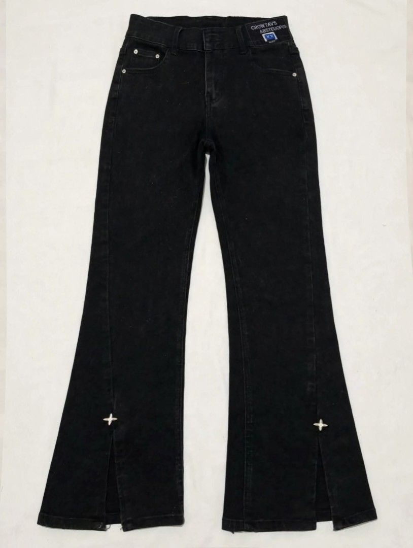GUAYDIAN Black Flare Jeans with Split Hem (Category: Jeans) located in Manila. Submitted by angelic.clot (Listing ID 1462817597, Image 1). Description: - Brand: GUAYDIAN - Style: Black flare jeans - Fit: High-waisted - Features: Split hem with small cross detail on each leg - Versatility: Perfect for dressing up or down.