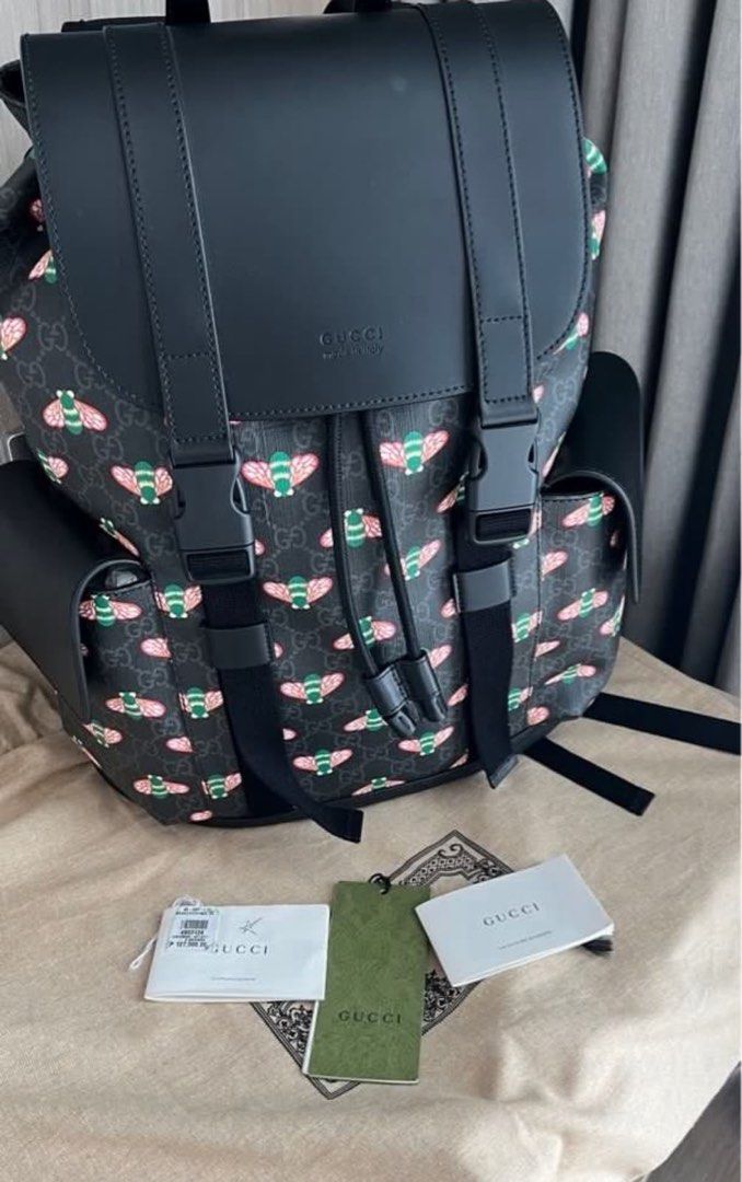 Gucci Bee Print Backpack Black Leather (Category: Luxury Bags & Wallets) located in Makati City. Submitted by elenank.595 (Listing ID 1464188944, Image 3). Description: Authentic Gucci backpack with iconic bee print and black leather details. Features drawstring closure, buckle straps, and side pockets. Includes dust bag and tags. Original price P 127,500. No flaws! Big backpack, unisex :) welcome to inspect in person..
