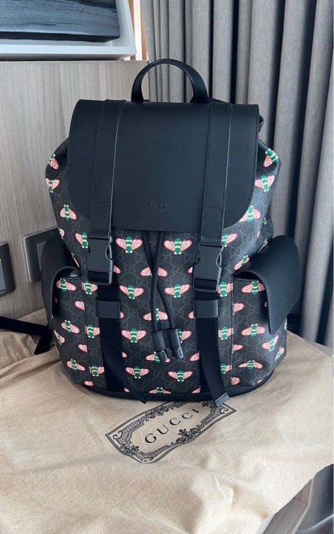 Gucci Bee Print Backpack Black Leather (Category: Luxury Bags & Wallets) located in Makati City. Submitted by elenank.595 (Listing ID 1464188944, Image 1). Description: Authentic Gucci backpack with iconic bee print and black leather details. Features drawstring closure, buckle straps, and side pockets. Includes dust bag and tags. Original price P 127,500. No flaws! Big backpack, unisex :) welcome to inspect in person..