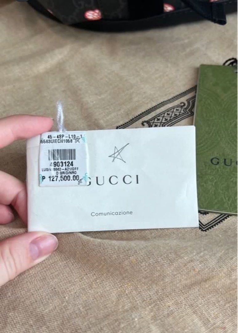 Gucci Bee Print Backpack Black Leather (Category: Luxury Bags & Wallets) located in Makati City. Submitted by elenank.595 (Listing ID 1464188944, Image 2). Description: Authentic Gucci backpack with iconic bee print and black leather details. Features drawstring closure, buckle straps, and side pockets. Includes dust bag and tags. Original price P 127,500. No flaws! Big backpack, unisex :) welcome to inspect in person..