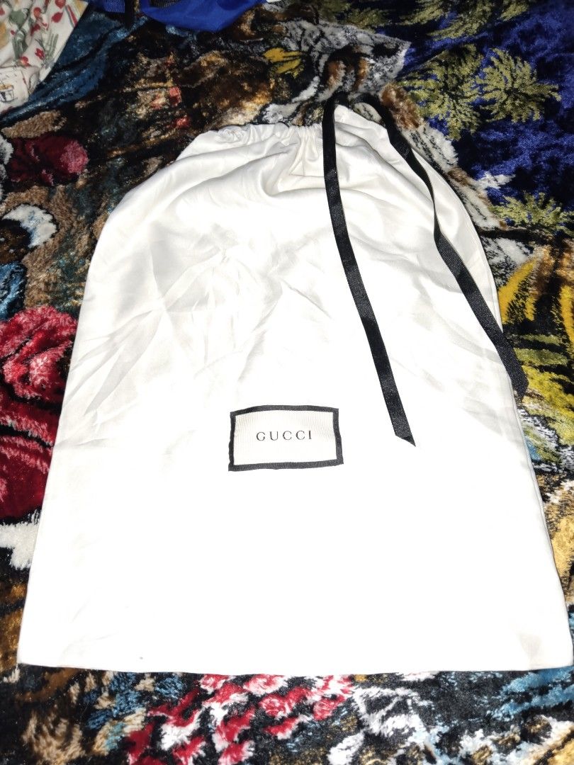 Gucci Dust Bag (Category: Belt bags, Clutches and Pouches) located in Mabalacat. Submitted by al_amin_thrift (Listing ID 1464225200, Image 2). Description: Authentic GUCCI Dust Bag — Large Size ✔️ Original Gucci storage / shoe bag ✔️ Cream-white fabric with black trim & drawstrings ✔️ Embroidered Gucci logo — clean & neat ✔️ Keeps shoes, bags, clothes dust-free ✔️ Excellent condition — no holes, stains, or tears ✔️ Large size — fits most sneakers