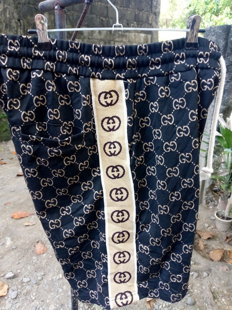 Gucci GG Monogram Shorts Size M (Category: Shorts) located in Manila. Submitted by adrianloqu02215 (Listing ID 1464182532, Image 2). Description: - Authentic Gucci shorts - All-over GG monogram print (black/beige) - Side stripe detail - Drawstring waist - Made in Italy - Cotton blend fabric - Size M.