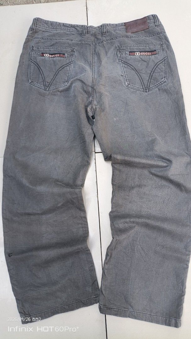 Gucci Grey Denim Jeans (Category: Chinos) located in Manila. Submitted by treblig. (Listing ID 1464214651, Image 2). Description: - Genuine Gucci grey denim jeans - Classic five-pocket design - Features iconic Gucci logo on back pockets - Made in Italy - Ideal for casual wear.