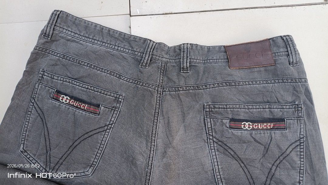 Gucci Grey Denim Jeans (Category: Chinos) located in Manila. Submitted by treblig. (Listing ID 1464214651, Image 3). Description: - Genuine Gucci grey denim jeans - Classic five-pocket design - Features iconic Gucci logo on back pockets - Made in Italy - Ideal for casual wear.