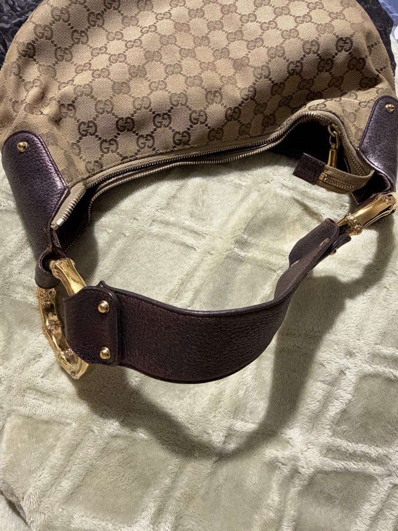 Gucci Monogram Bamboo Handle Hobo Bag (Category: Luxury Bags & Wallets) located in Quezon City. Submitted by vaaaaaaa_ (Listing ID 1464215860, Image 2). Description: - Authentic Gucci Hobo Bag - Classic GG Monogram Canvas - Dark Brown Leather Trim - Iconic Bamboo Handle - Gold-Tone Hardware - Zipper Closure - Dust Bag Included - Ideal for Everyday Use.