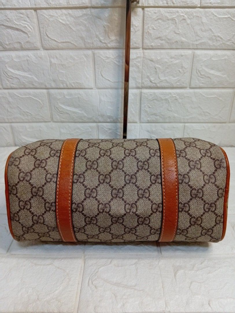 Gucci Monogram Canvas Leather Trim Boston Bag (Category: Luxury Bags & Wallets) located in Las Pinas. Submitted by etoksi1234 (Listing ID 1464196357, Image 3). Description: Pre-loved Gucci Small Joy Boston Bag, distinguished by its classic beige and ebony GG coated canvas body paired with contrasting brown rolled leather trim..