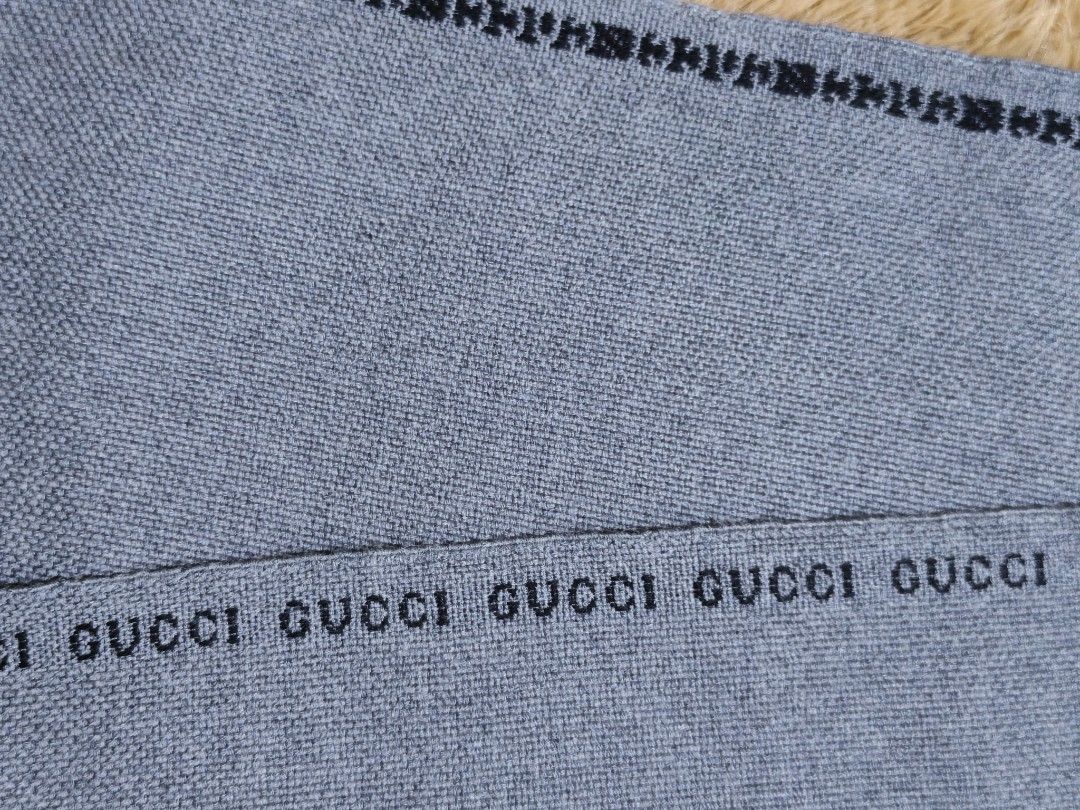Gucci Scarf (Category: Scarves) located in Baguio. Submitted by sky_alexander143 (Listing ID 1464301681, Image 1). Description: - Authentic Gucci Scarf - 100% Wool, Made in Italy - Iconic repeating Gucci logo pattern - Soft and warm, ideal for cooler weather - Classic fringed ends - Dry clean only.