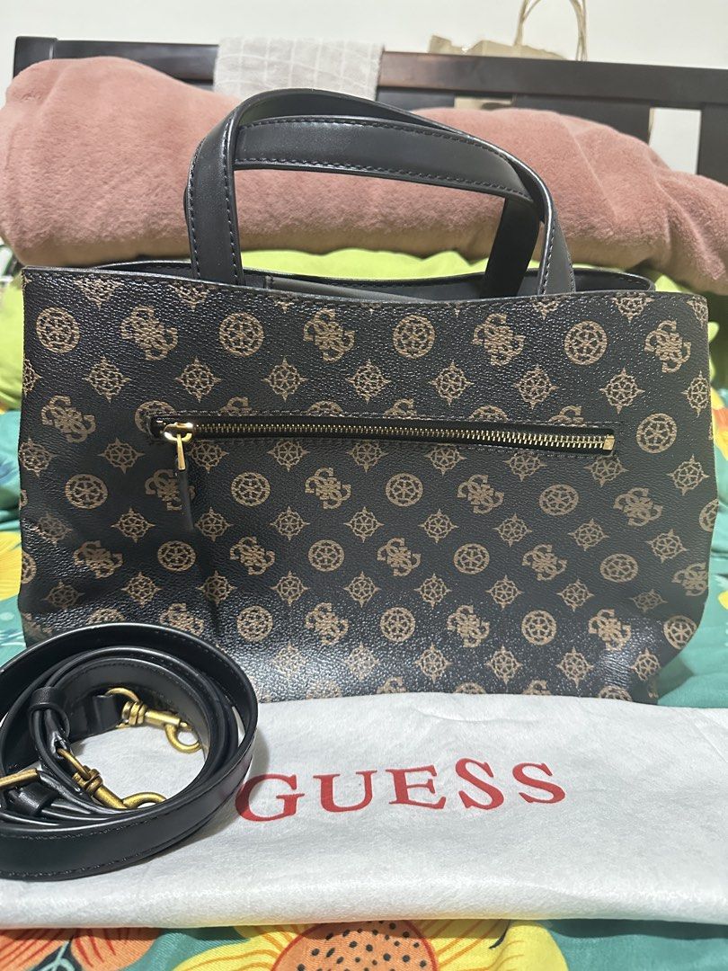 Guess Monogram Tote Bag with Strap (Category: Tote Bags) located in Manila. Submitted by biskybysh (Listing ID 1464347221, Image 2). Description: - Classic Guess tote bag - Signature all-over monogram print - Zip closure for main compartment - Exterior zip pocket - Multiple interior pockets for organization - Detachable shoulder strap included - Gold hardware details.