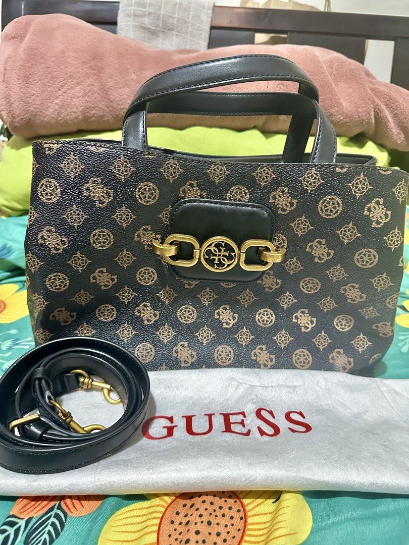 Guess Monogram Tote Bag with Strap (Category: Tote Bags) located in Manila. Submitted by biskybysh (Listing ID 1464347221, Image 1). Description: - Classic Guess tote bag - Signature all-over monogram print - Zip closure for main compartment - Exterior zip pocket - Multiple interior pockets for organization - Detachable shoulder strap included - Gold hardware details.