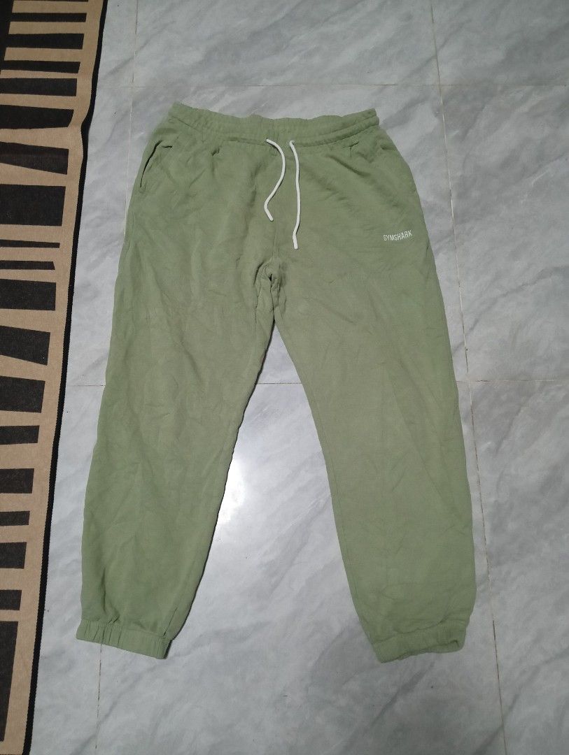 gymshark Sweatpants with Drawstring (Category: Joggers) located in Odiongan. Submitted by thrifthub_bundang07 (Listing ID 1464261190, Image 1). Description: -Gymshark sweatpants size large Comfortable sage green sweatpants - Elastic waistband with white drawstring - Cuffed ankles for a snug fit - Small logo detail on the left thigh - Ideal for lounging or casual wear.