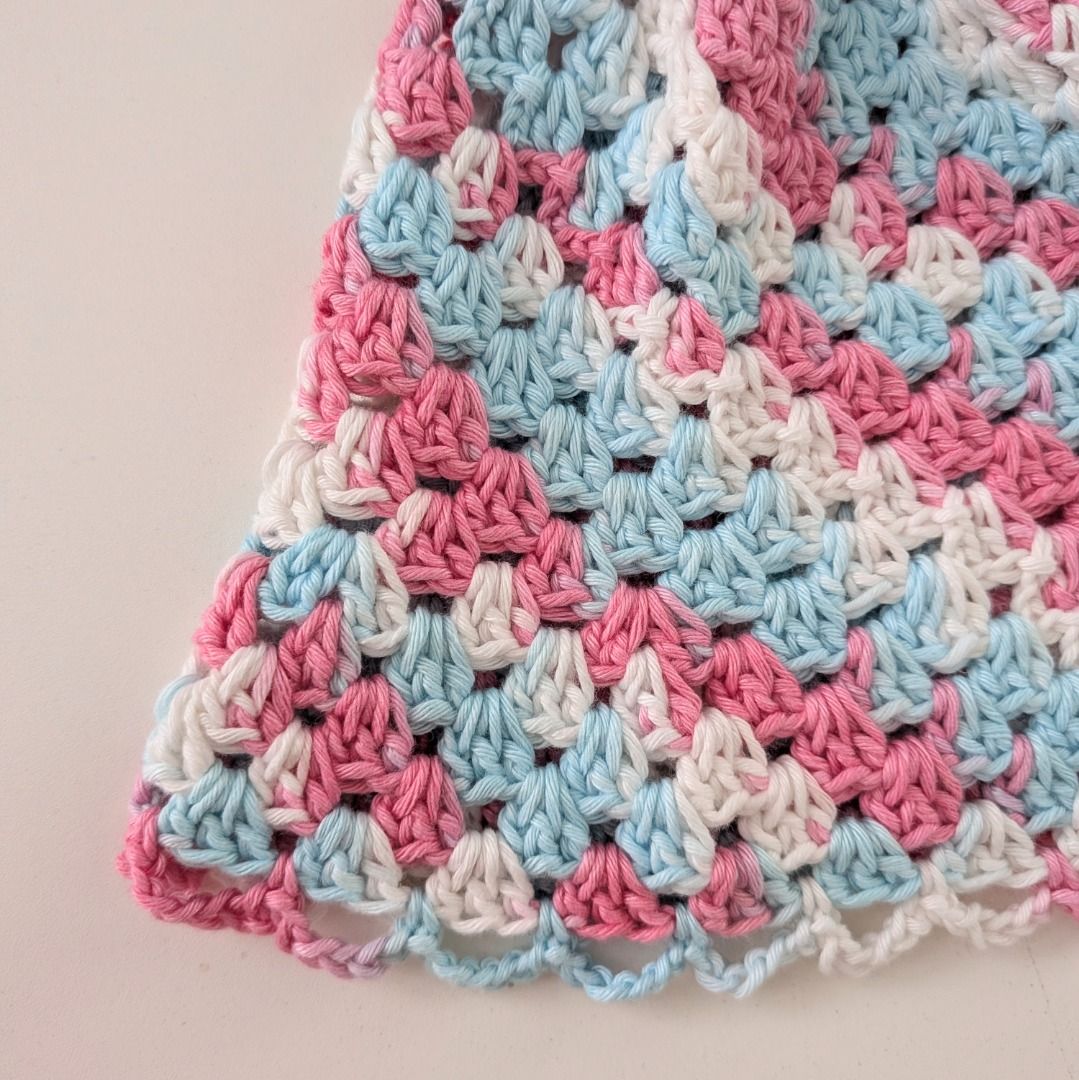 [Handmade] Crochet Bucket Hat - pink, white, blue (Category: Hats & Beanies) located in Quezon City. Submitted by user81204 (Listing ID 1464142389, Image 3). Description: - Crochet bucket hat handmade by me🧶☺️ - Features a colorful granny square pattern (pink, blue, white) - Delicate scalloped edge on the brim - Ideal for sunny days and as a fun accessory - Unique, one-of-a-kind handmade item Size: 52cm circumference 20cm length.