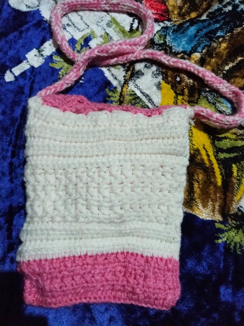 Handmade Crochet Crossbody Bag (Category: Cross-body Bags) located in Mabalacat. Submitted by al_amin_thrift (Listing ID 1464232750, Image 3). Description: 🌸 Handmade Crochet Crossbody Bag — Pink & Cream Item Details - Style: Hand-crocheted / hand-knit crossbody purse — one-of-a-kind piece ​ - Colors: Soft pink + creamy white / off-white ​ - Material: Soft, smooth yarn — lightweight, flexible, and gentle to touch ​ - Design & Features: ​ - Intri