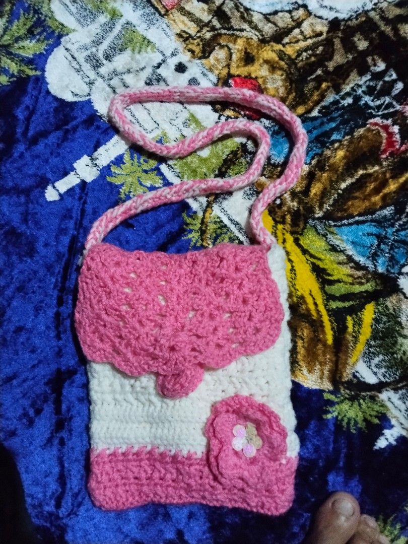 Handmade Crochet Crossbody Bag (Category: Cross-body Bags) located in Mabalacat. Submitted by al_amin_thrift (Listing ID 1464232750, Image 2). Description: 🌸 Handmade Crochet Crossbody Bag — Pink & Cream Item Details - Style: Hand-crocheted / hand-knit crossbody purse — one-of-a-kind piece ​ - Colors: Soft pink + creamy white / off-white ​ - Material: Soft, smooth yarn — lightweight, flexible, and gentle to touch ​ - Design & Features: ​ - Intri