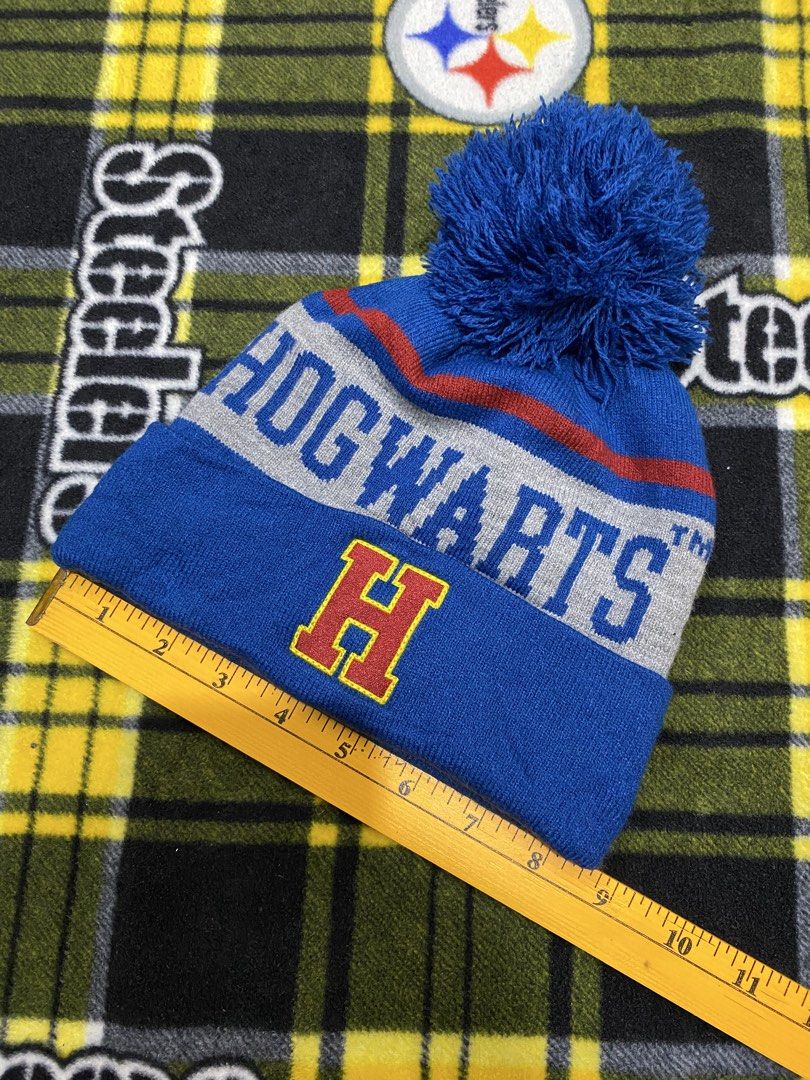 HARRY POTTER, beanie hat (Category: Beanies) located in Cavite. Submitted by jc_thrift95 (Listing ID 1464221439, Image 2). Description: - That vibrant blue Harry Potter Hogwarts Pom Pom Beanie features a cozy folded cuff highlighted by a bold yellow “H” logo and embroidered “HOGWARTS” lettering - Color rate 8/10 - See pictures details for dimes..