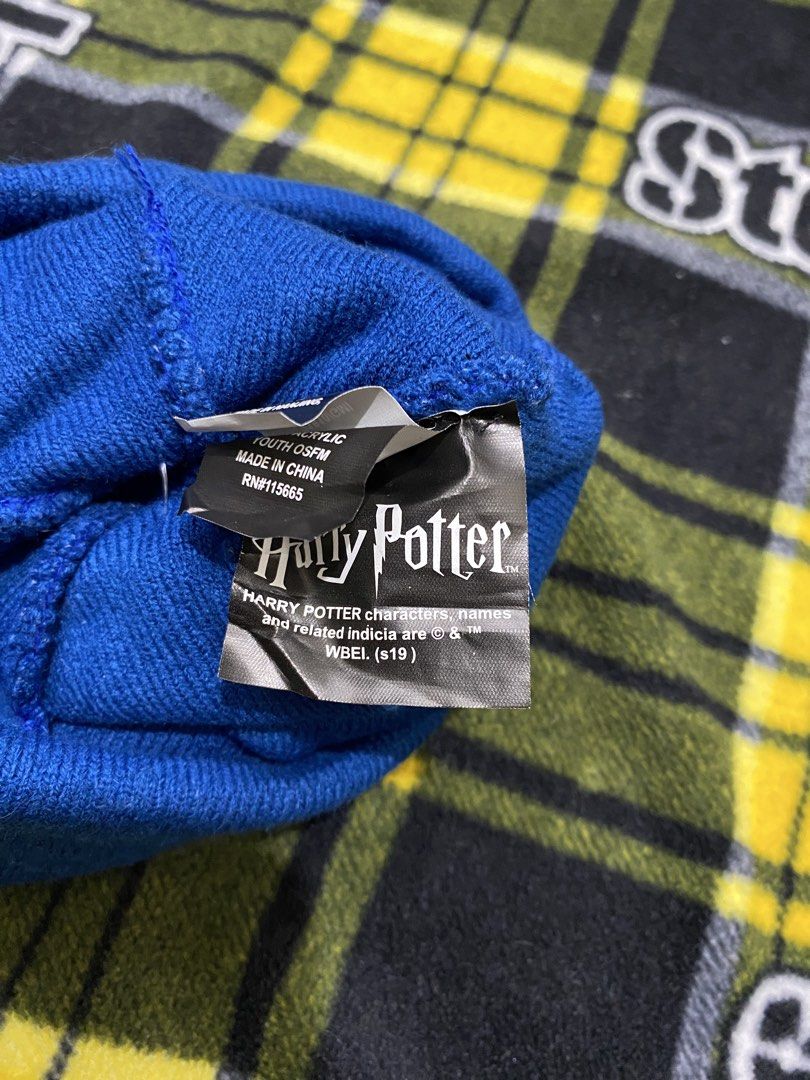 HARRY POTTER, beanie hat (Category: Beanies) located in Cavite. Submitted by jc_thrift95 (Listing ID 1464221439, Image 3). Description: - That vibrant blue Harry Potter Hogwarts Pom Pom Beanie features a cozy folded cuff highlighted by a bold yellow “H” logo and embroidered “HOGWARTS” lettering - Color rate 8/10 - See pictures details for dimes..